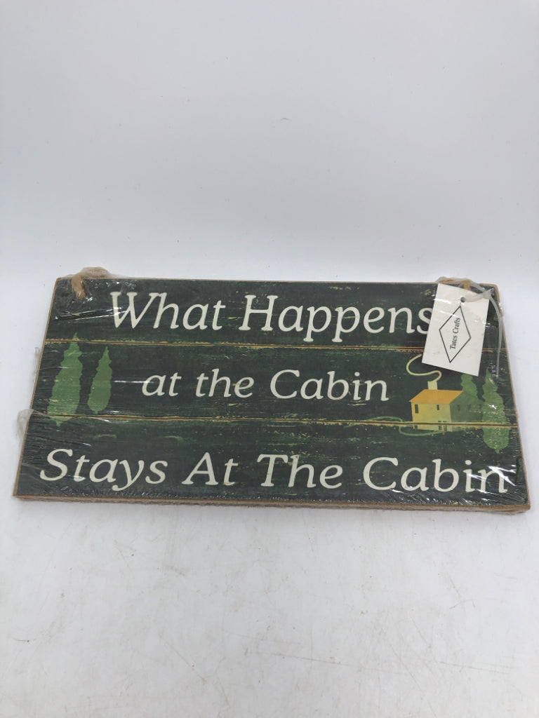 NIP WHAT HAPPENS AT THE CABIN WOODEN HANGING.