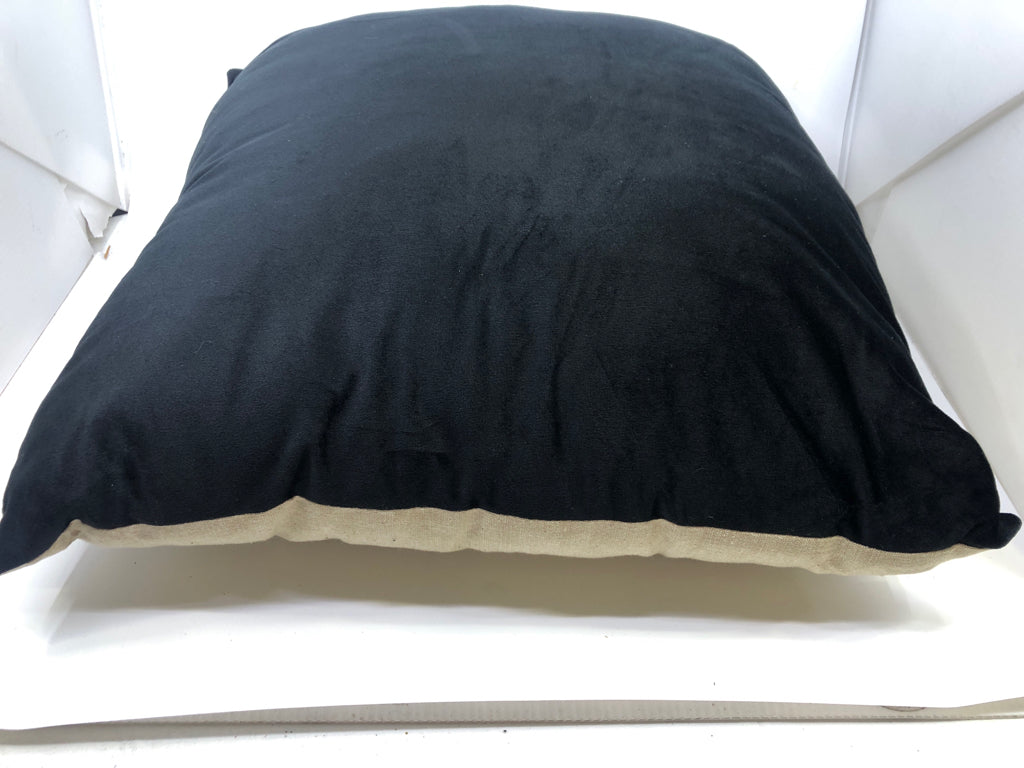 BLACK AND TAN PILLOW.