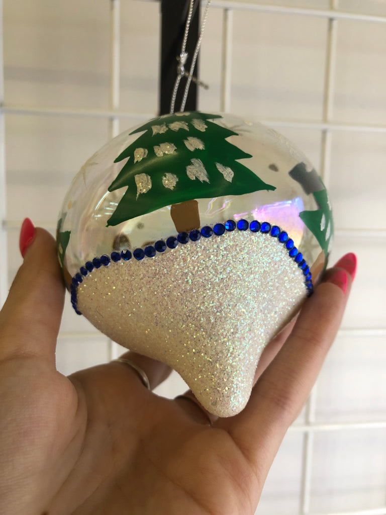 IRIDESCENT GLASS ORNAMENT W/ PAINTED TEDDY RED/GREEN SWEATER.