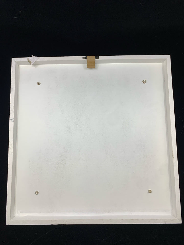 STAY HUMBLE WORK HARD KIND METAL CUT-OUT SIGN ON WHITE WOOD.