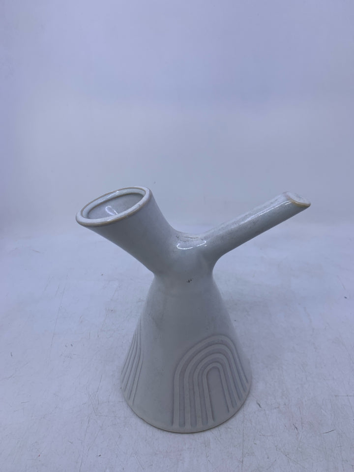 WHITE VASE W/ CARVED ARCHES HANDLE W/ SLATED NECK.