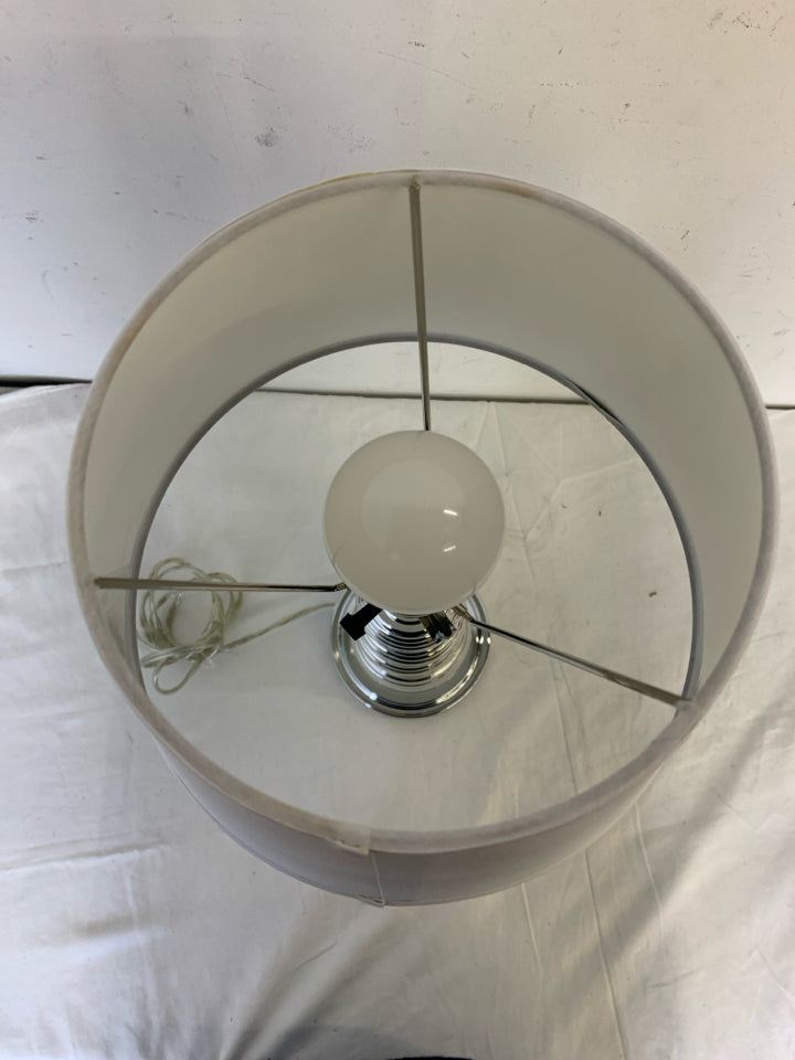 SILVER PLASTIC BASE LAMP W/WHITE SHADE.