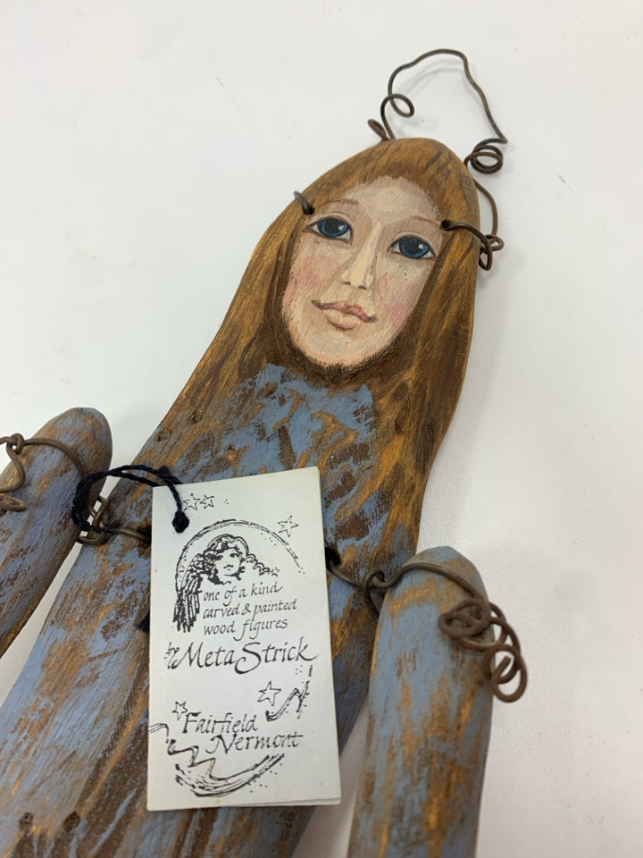 PRIMITIVE WOOD DOLL W WATERING CAN WALL HANGING.