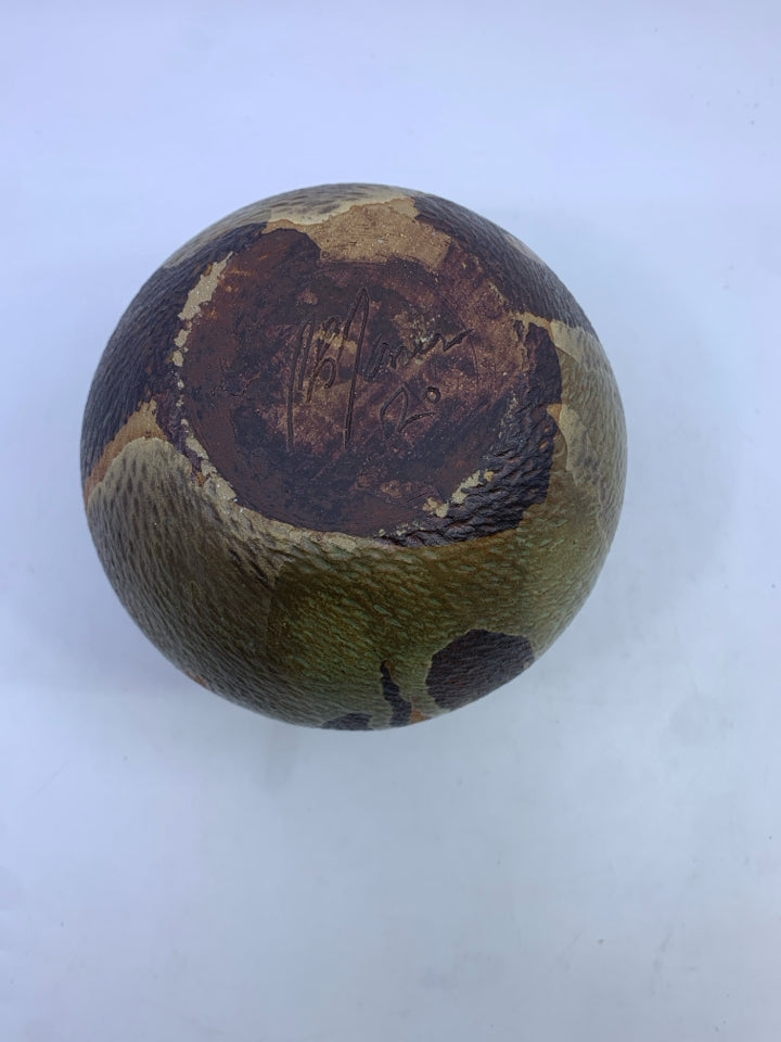 GREEN AND BROWN CARVED POTTERY VASE.