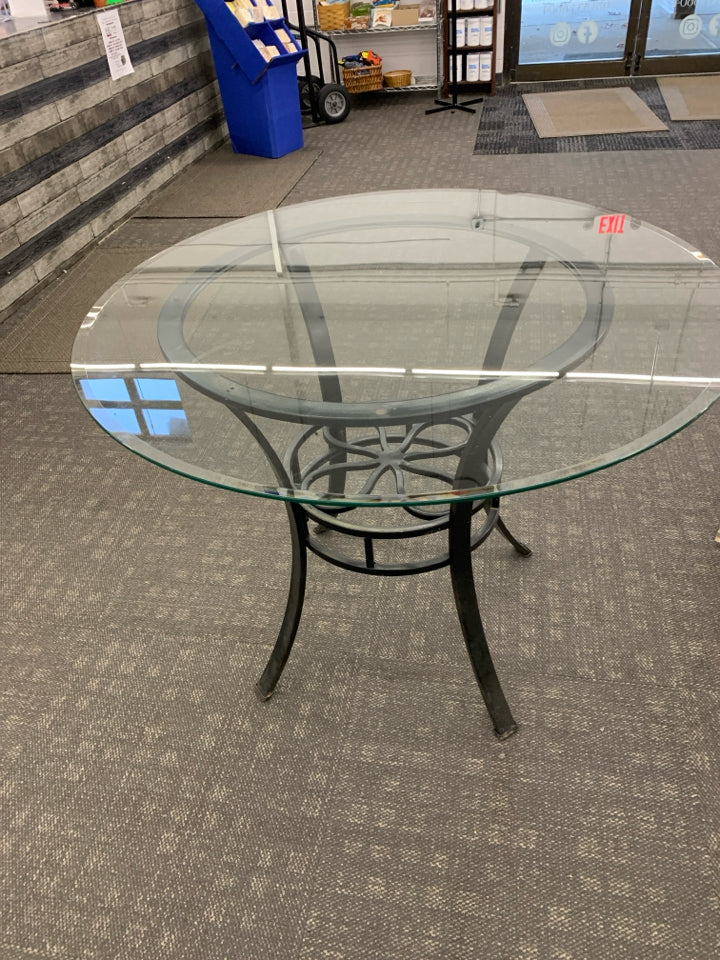 METAL FLOWER TABLE W/GLASS CIRCLE TOP.