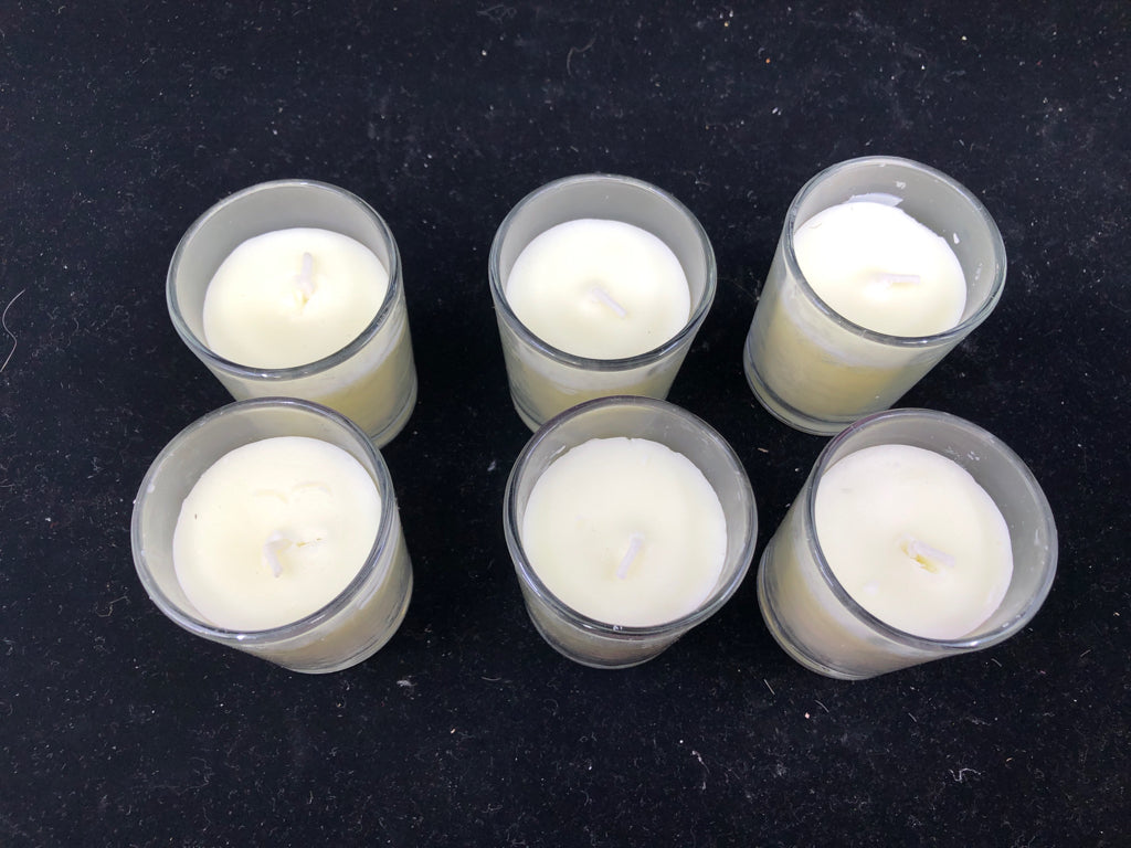 6 SCENTED VOTIVE CANDLES.