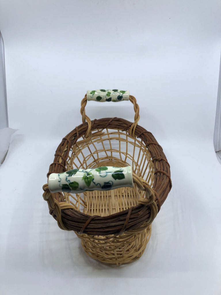 OVAL BASKET W/ CERAMIC HANDLES VINE PATTERN.