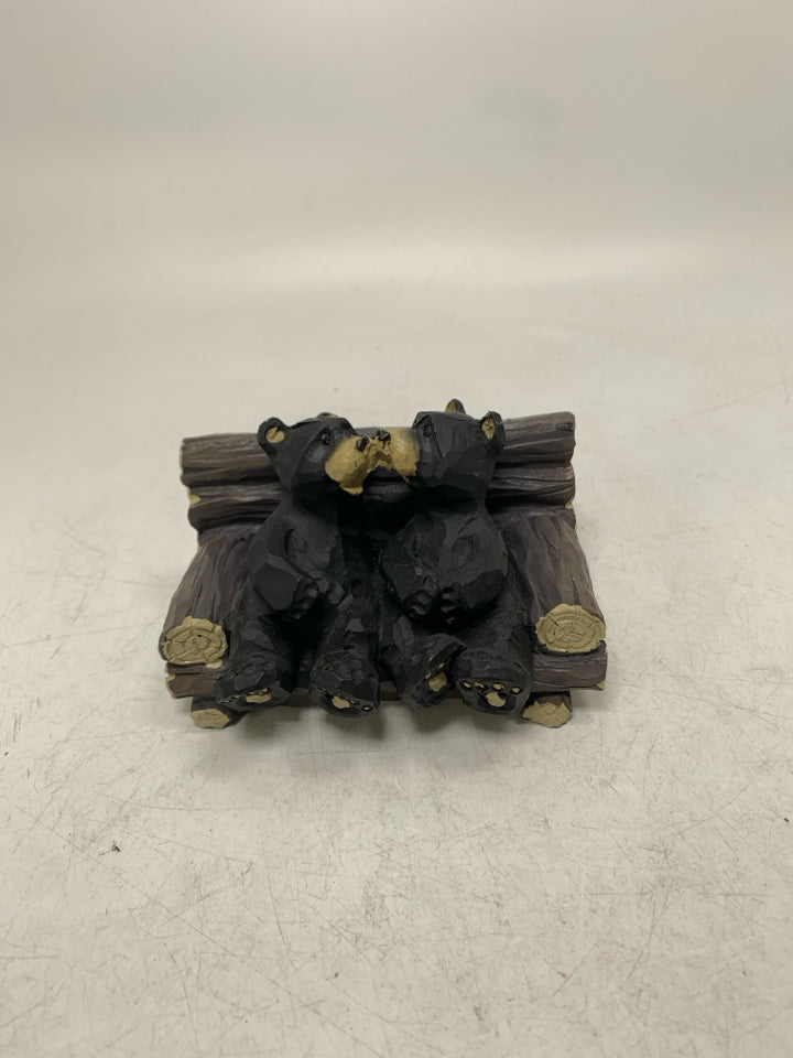 2 BLACK BEARS ON BENCH TOUCHING NOSES RESIN.