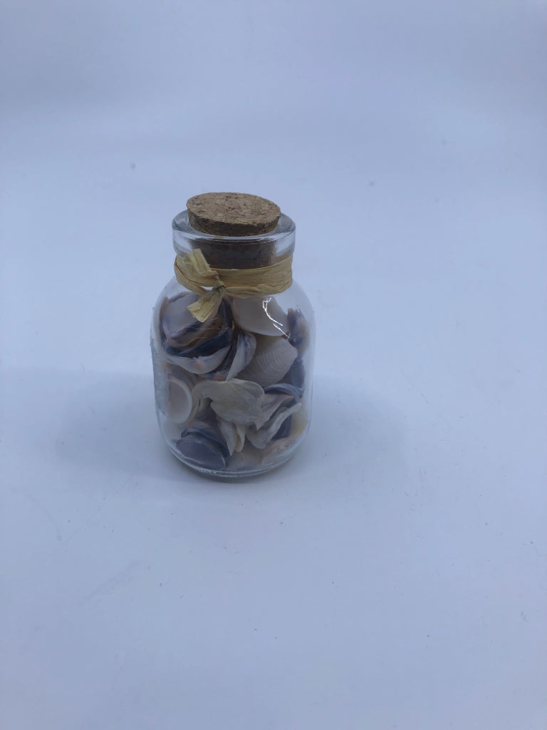 SMALL BOTTLE W SHELLS.