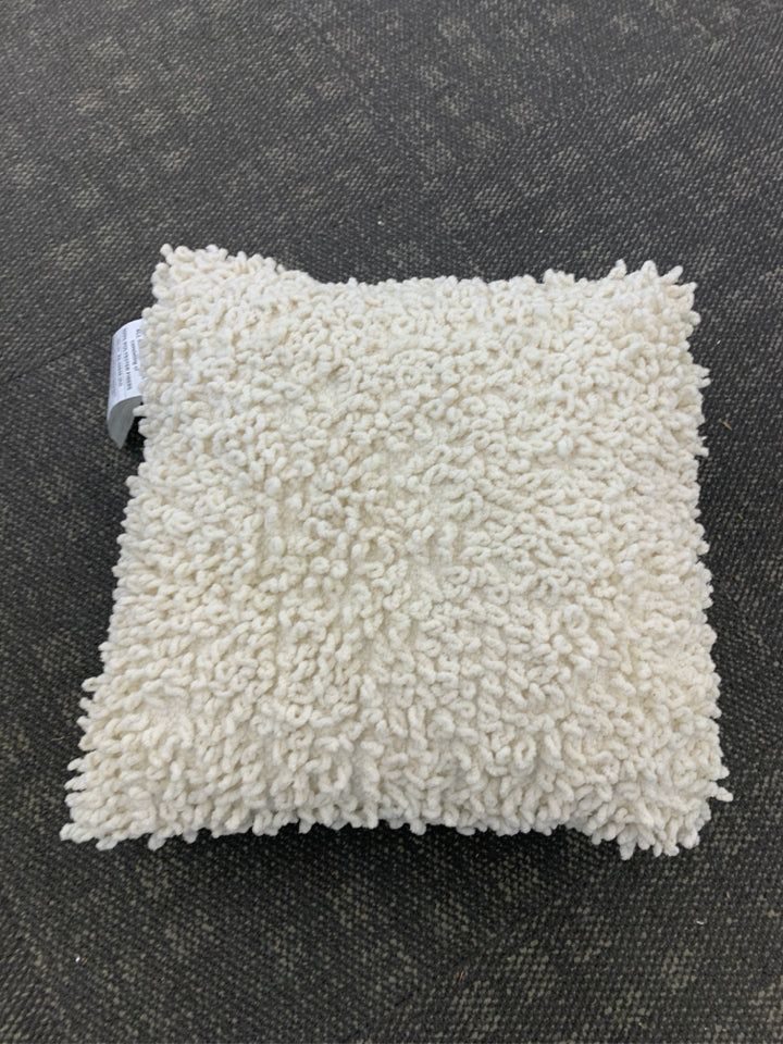WHITE TEXTURED LOOP PILLOW.