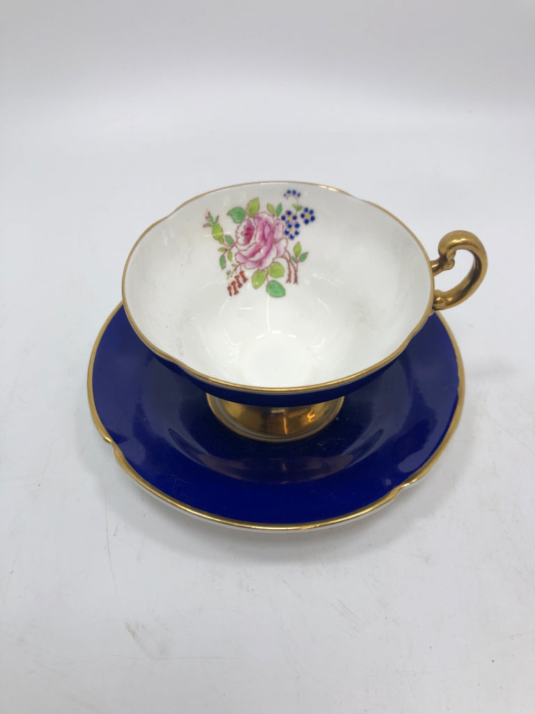 VTG COBALT BLUE TEACUP SAUCER W/ROSE AND GOLD RIM.