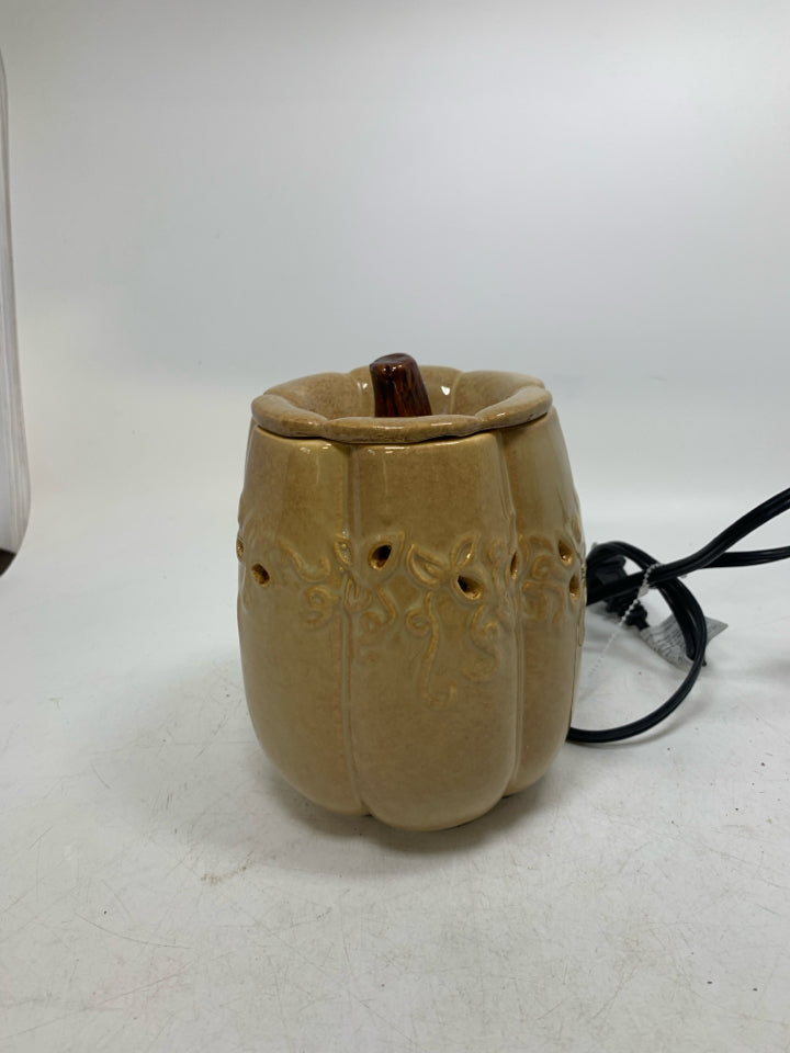 TAN PUMPKIN SHAPED PIERCED TART WARMER.