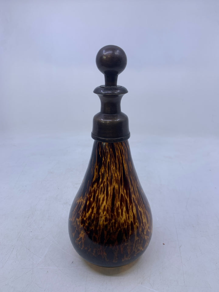 AMBER GLASS W/ LARGE BROWN SPOTS DECANTER W/ METAL STOPPER.