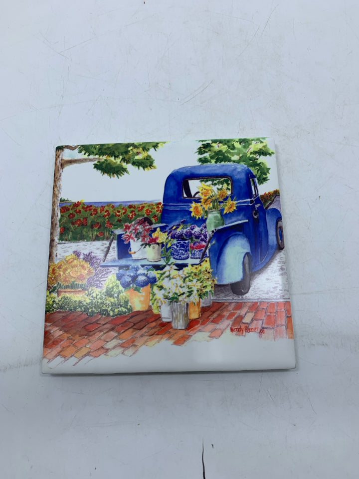 BLUE FARMER'S TRUCK FLORAL CERAMIC TILE WALL HANGING.