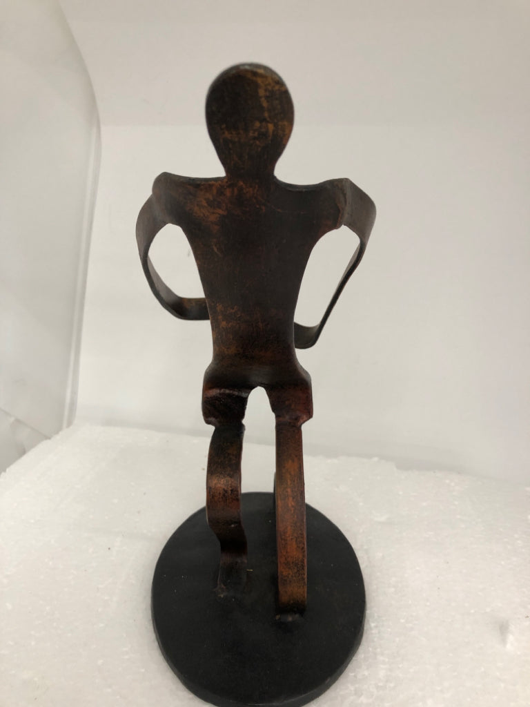 METAL HUMAN SCULPTURE ON STAND.