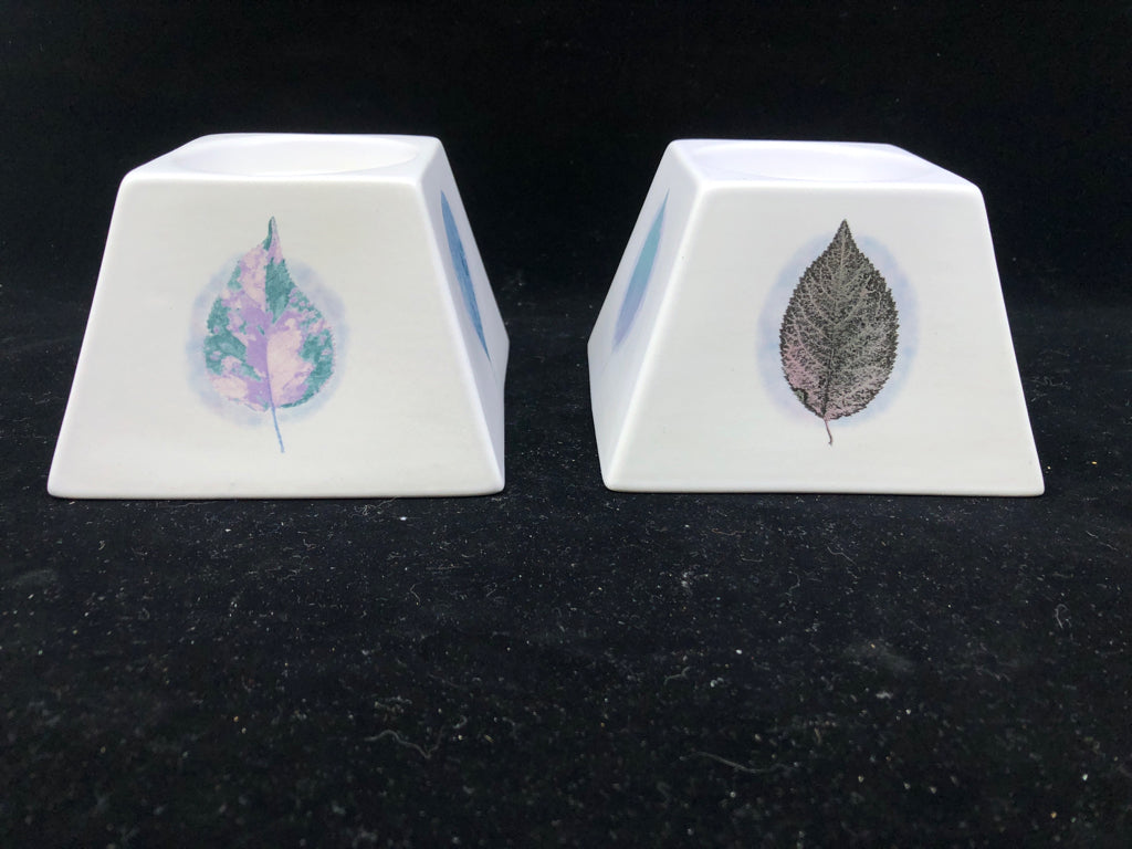 2 WHITE/ GREEN LEAVES DUSK CANDLE HOLDERS.