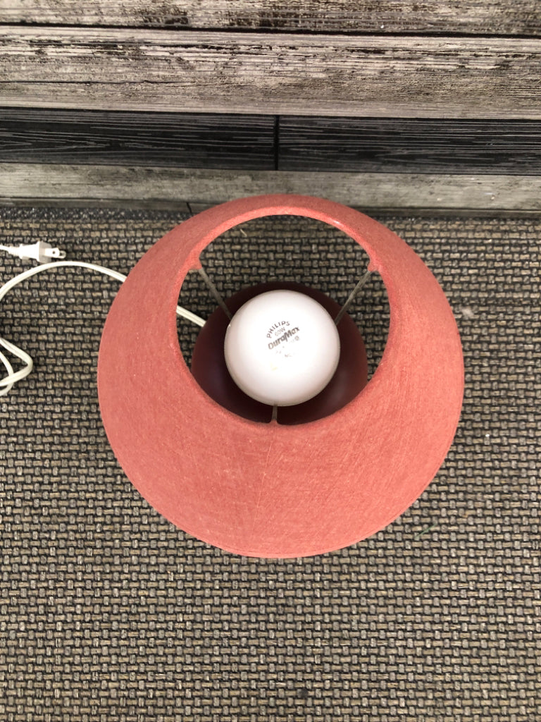 RED METAL CIRCLE BASE LAMP W/ RED SHADE.