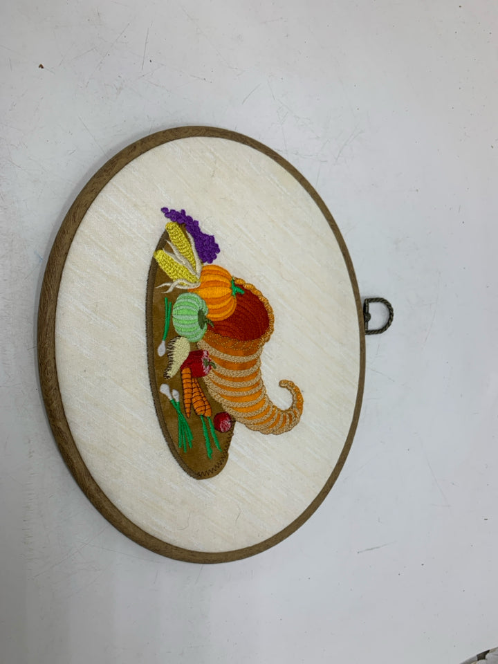 CORNUCOPIA EMBROIDERED OVAL WALL HANGING.