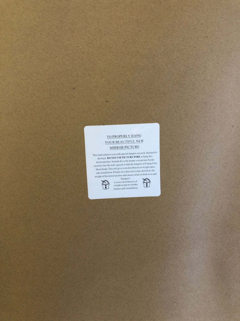 LARGE LEAF PHOTO IN LIGHT WOOD FRAME.