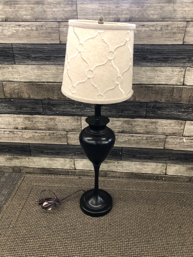 TALL METAL BASE W/ TAN TEXTURED SHADE.
