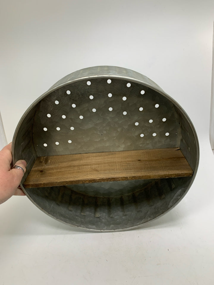 GALVANIZED PIERCED CIRCLE WALL HANGING W/ WOOD SHELF.