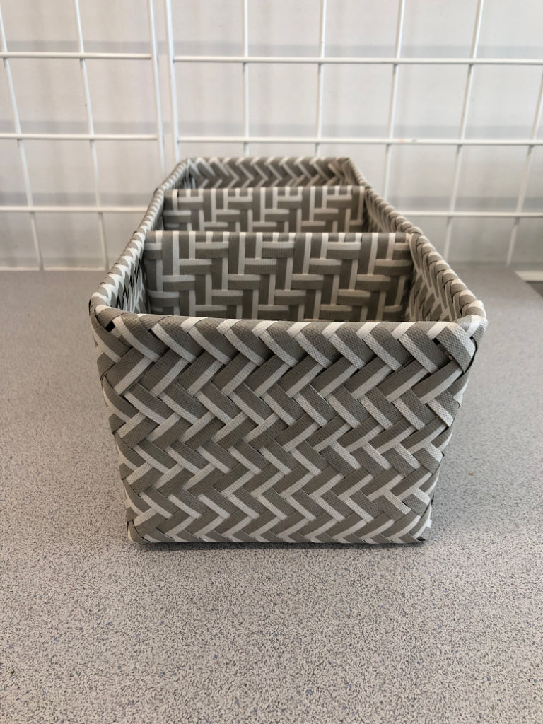 NARROW GRAY DIVIDED WOVEN STORAGE BIN.