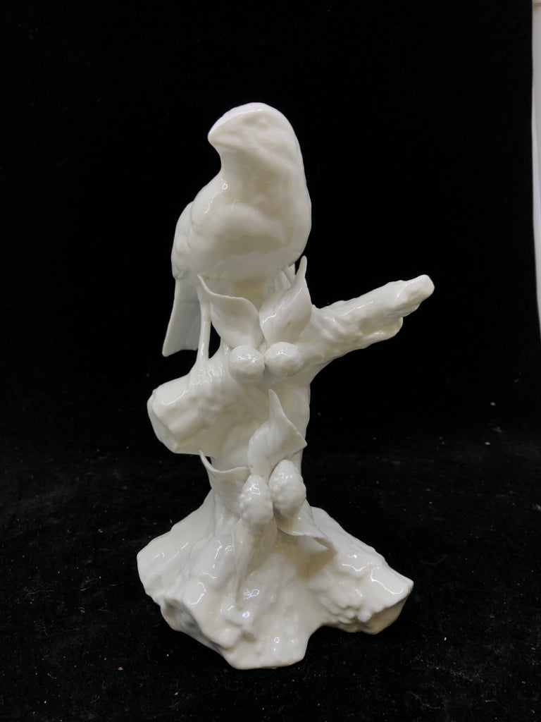 WHITE CERAMIC BIRD ON BRANCH.