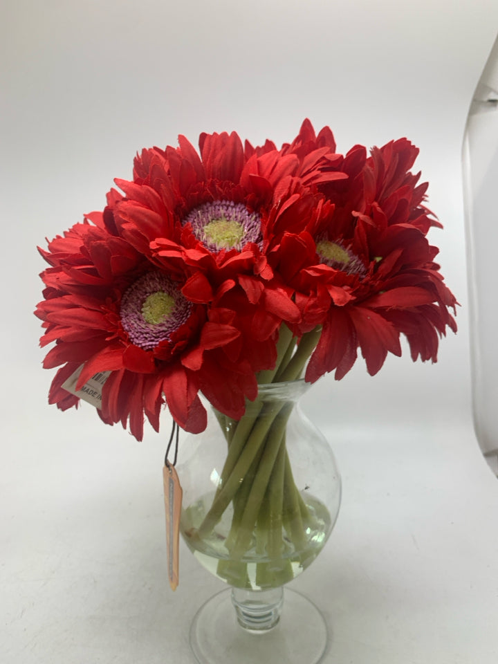 FOOTED GLASS VASE W/ FAUX RED DAISIES.