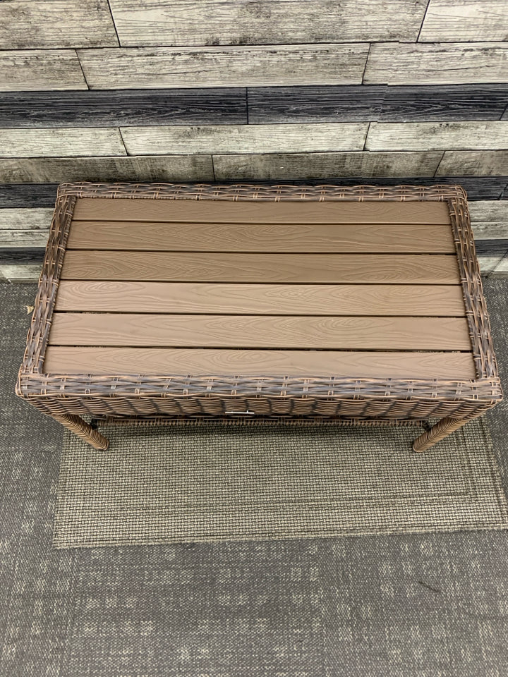 DARK WICKER W FAUX WOOD TOP COFFEE TABLE.