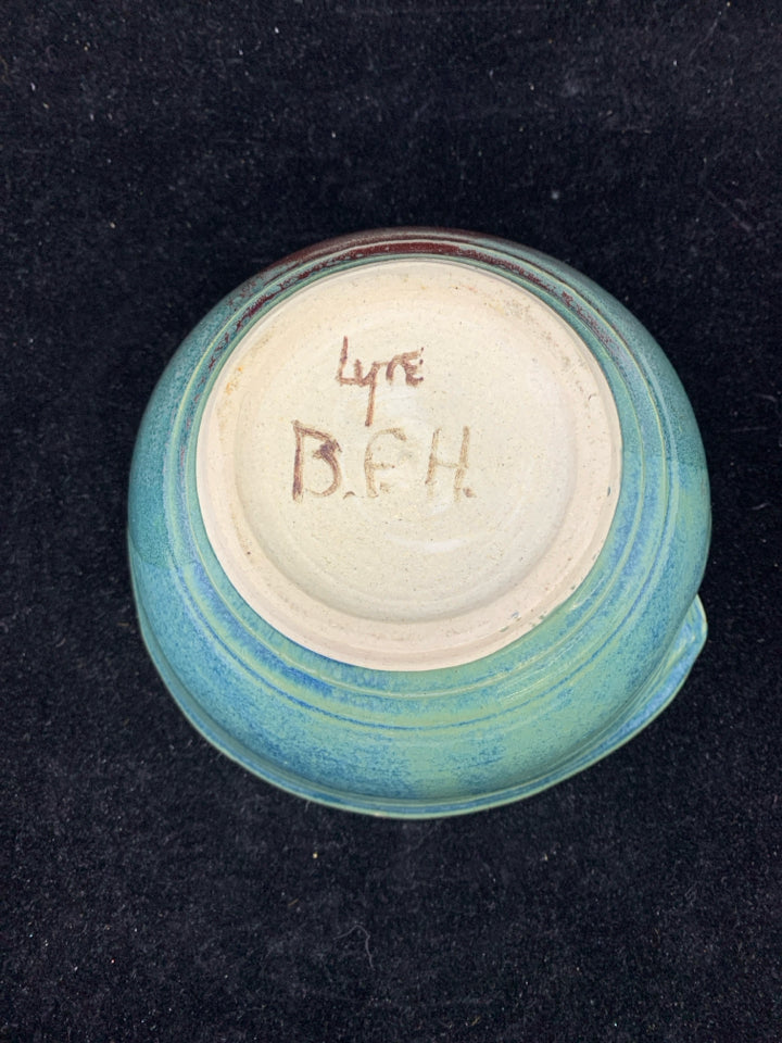 TEAL AND PURPLE POTTERY BOWL.
