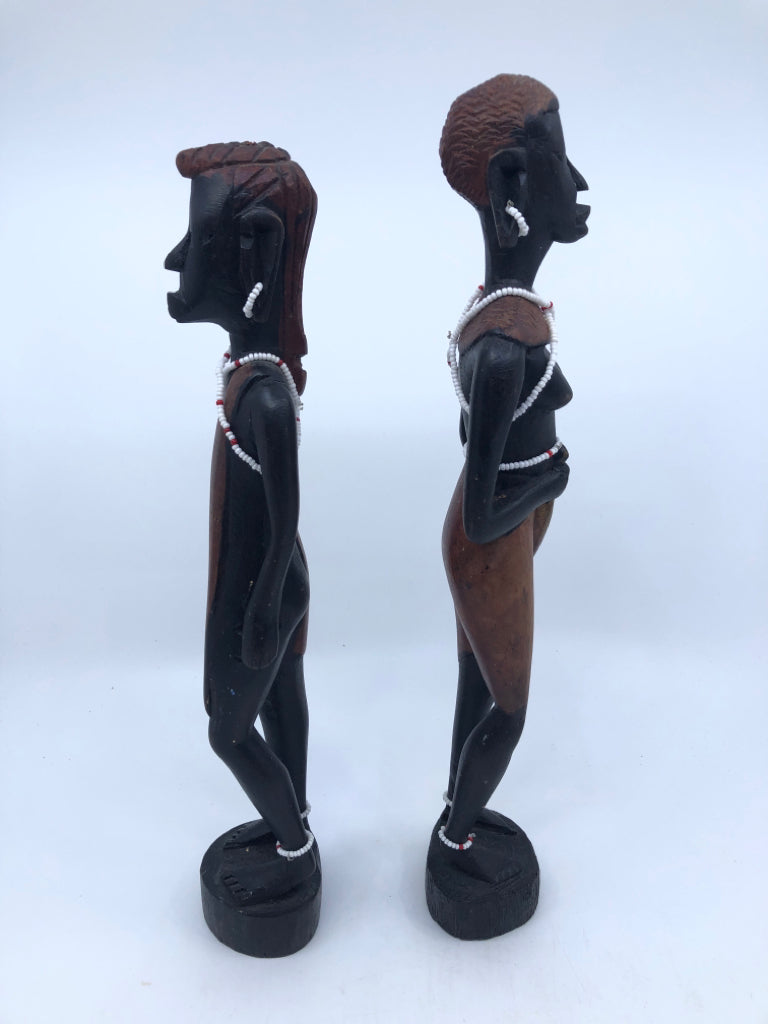 2-WOODEN MAN AND WOMAN CARVED FIGURES W BEADED JEWELRY.