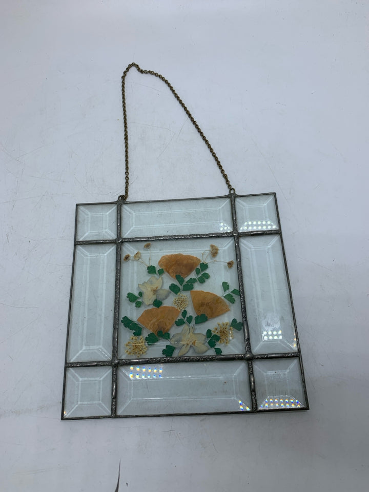STAINED GLASS W/ PRESSED FLOWERS IN CENTER WALL HANGING.