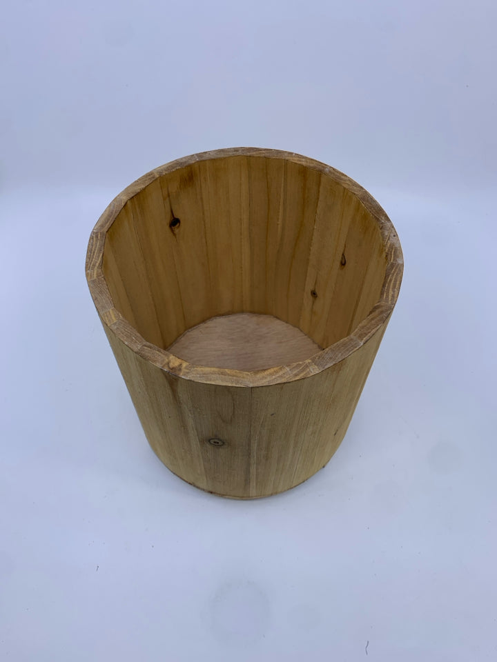 WOOD FOOTED PLANTER.