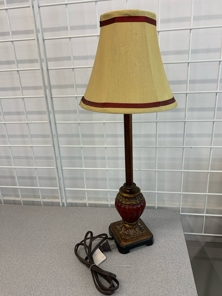 BROWN/RED BASE LAMP W/RED STRIPE SHADE.