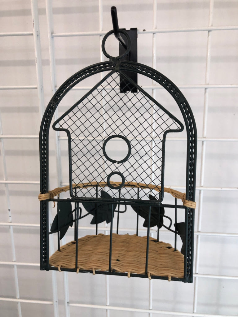GREEN METAL SHELF W WICKER BASE.