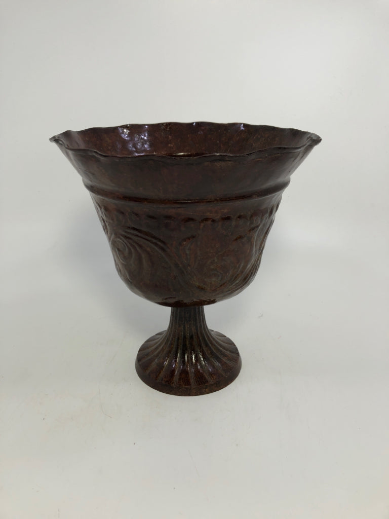 BROWN METAL FOOTED PLANTER.
