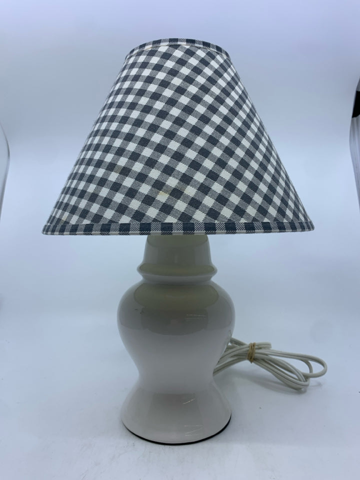 SMALL WHITE BASE LAMP W GREY CHECKERED SHADE.