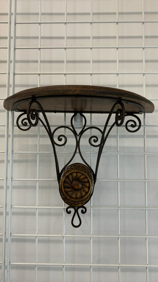 HALF CIRCLE WOOD WALL SHELF W/BROWN METAL SCROLL BASE.