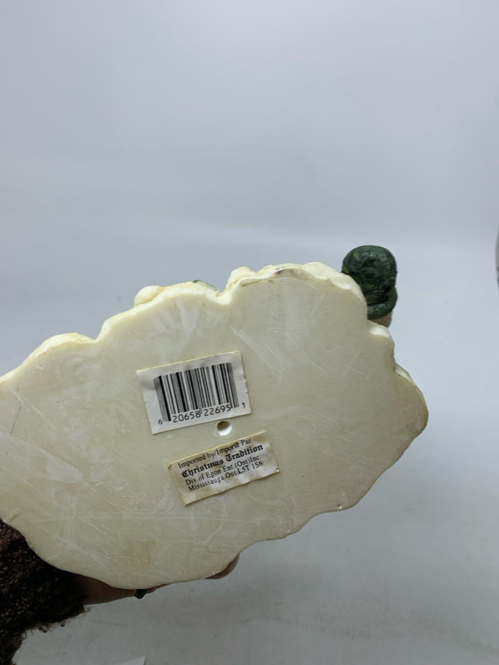 RESIN SNOWMAN ON SNOWBOARD.