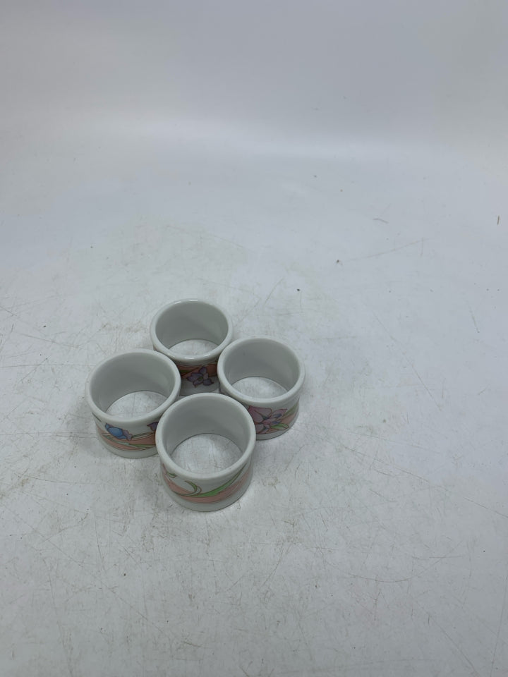 4 FLORAL PORCELAIN NAPKIN RINGS.