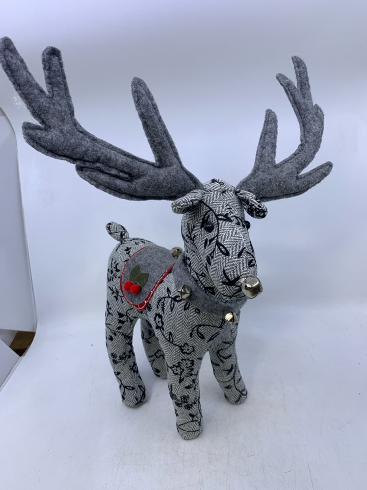 GREY W/ EMBROIDERED BLACK FLOWERS STANDING REINDEER PLUSH.
