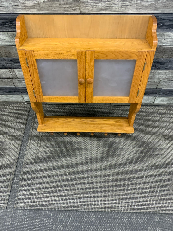 OAK WOOD SHELF W CABINET AND 6 HOOKS.