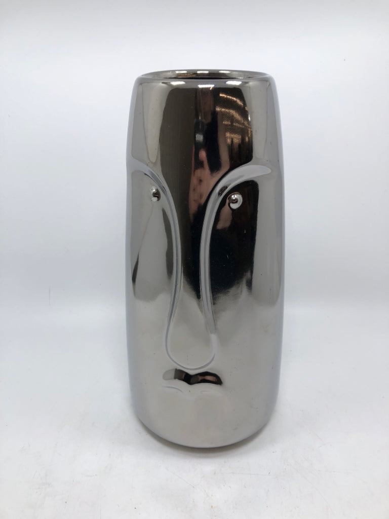 SILVER FACE VASE.