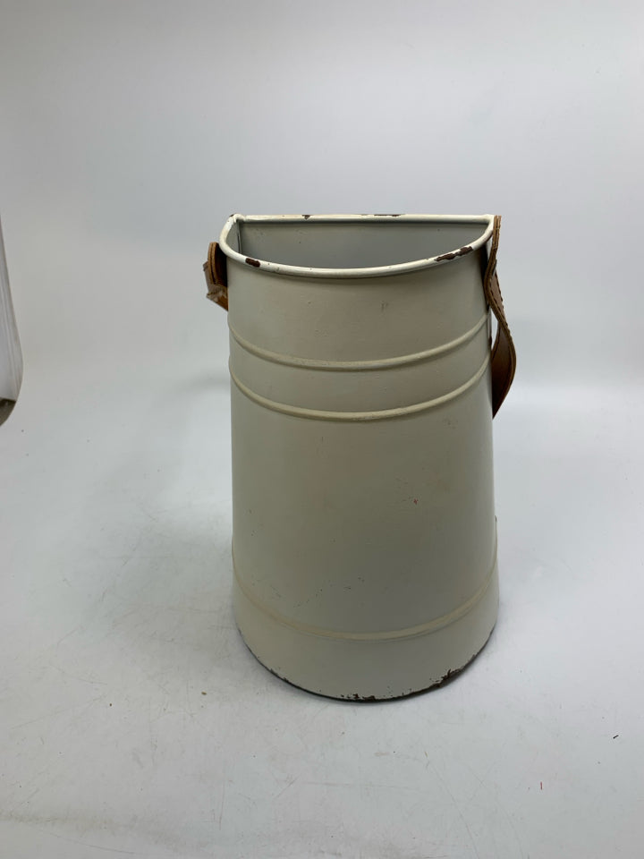 CREAM METAL HANGING PLANTER W/ FAUX LEATHER STRAP.