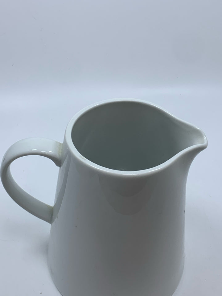 WHITE CERAMIC PITCHER.