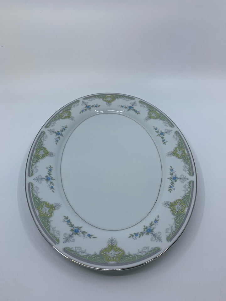 WHITE OVAL PLATTER W/ BLUE FLOWERS & GREEN DETAILS.