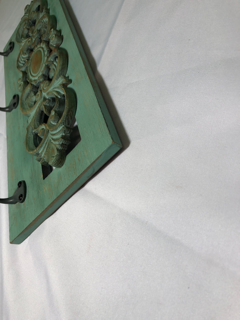 GREEN WASHED 3 HOOK WALL HANGING.