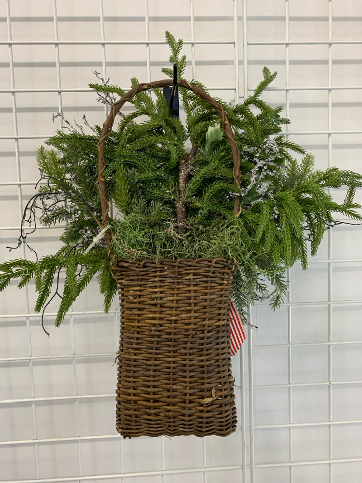 FAUX HOLLY AND GLITTER BRANCHES IN BASKET W/BOW.