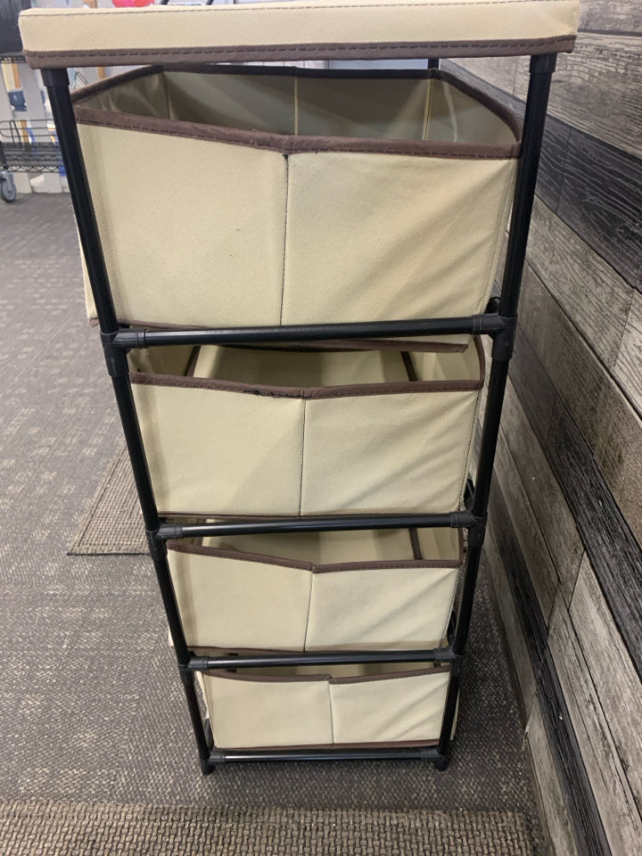 4 CUBE TAN FABRIC STORAGE W/BLACK PLASTIC FRAME.
