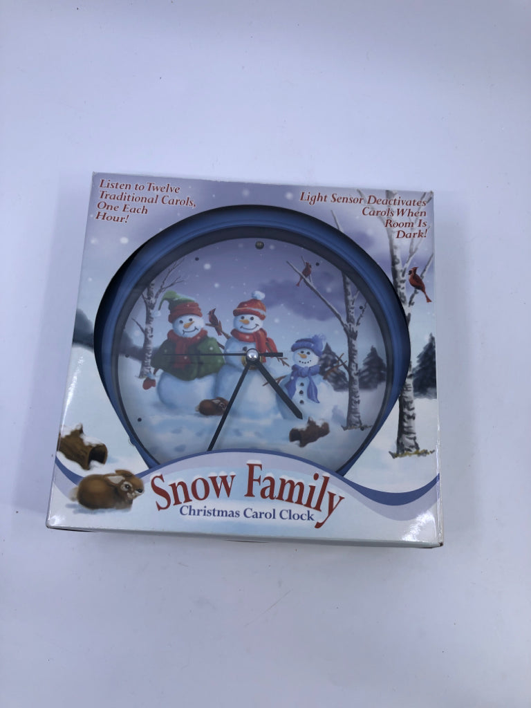 NIB SNOW FAMILY CHRISTMAS CAROL CLOCK.